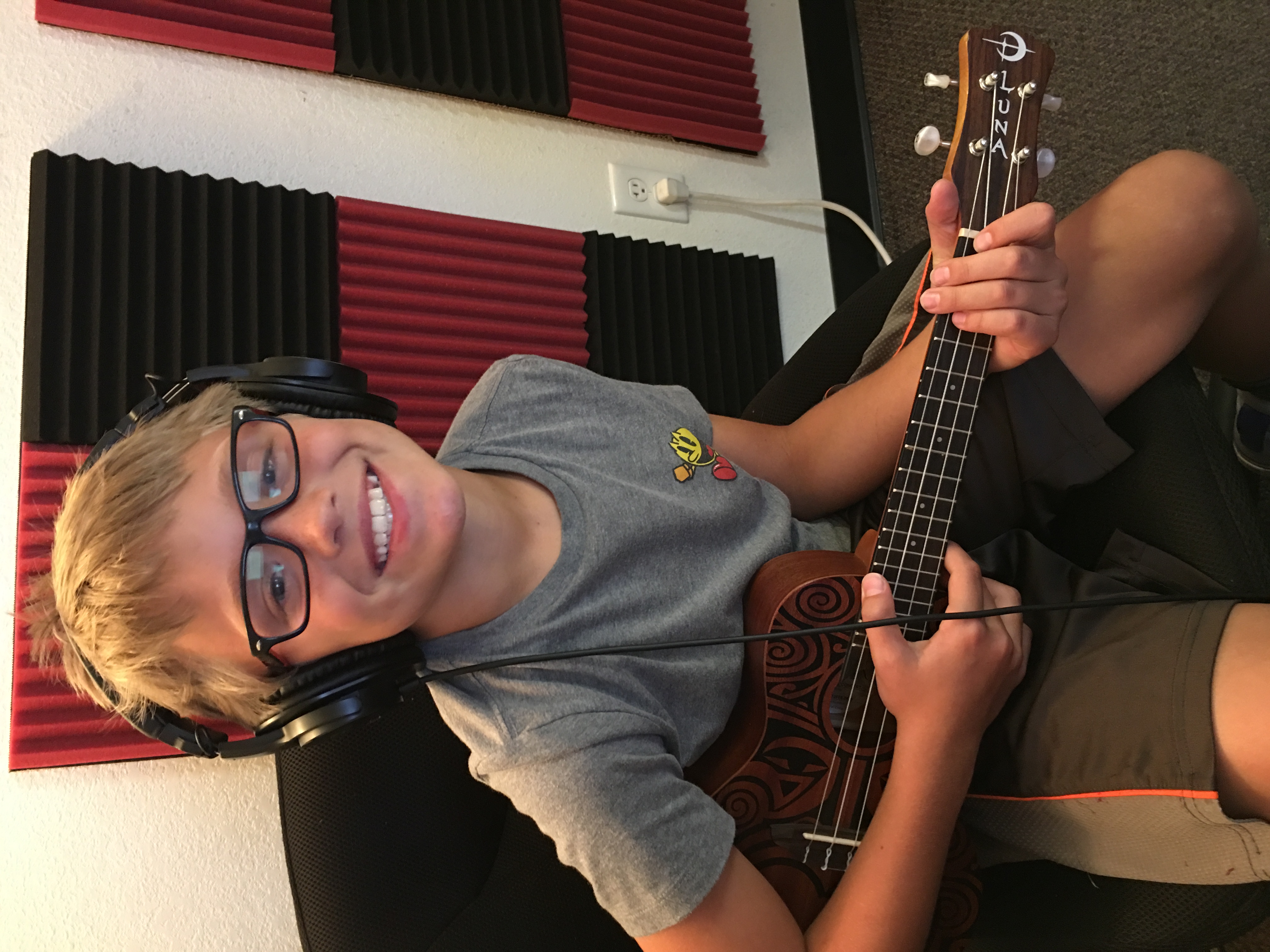Tommy taking ukulele lessons at Spotlight